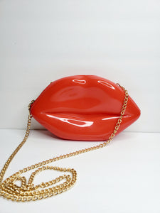 Lip shaped handbag. Roomy enough for basic essentials. Credit cards, cash, small cosmetics, keys, sunglasses